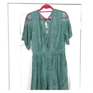 Romper with beautiful back low v neck!